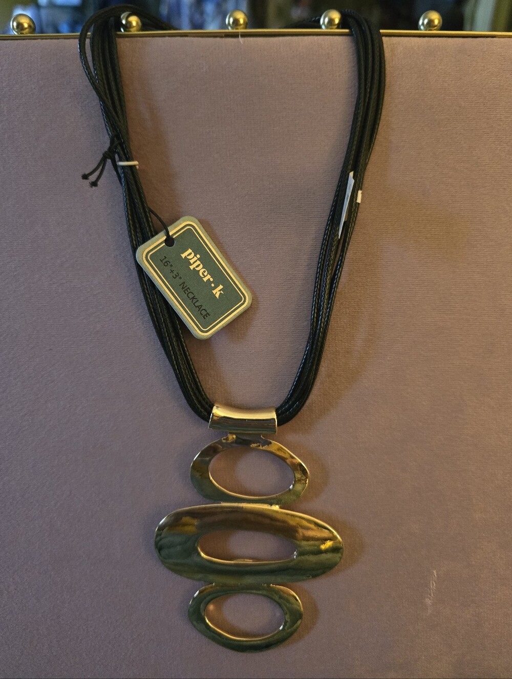 Black Cord Multi-Strand Necklace with Gold Triple Oval Pendant